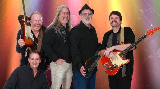 Instigator band posed on a staircase.